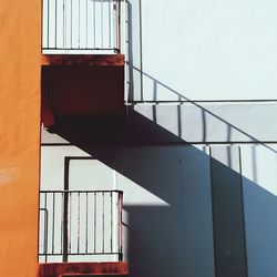 Orange staircase with long shadow