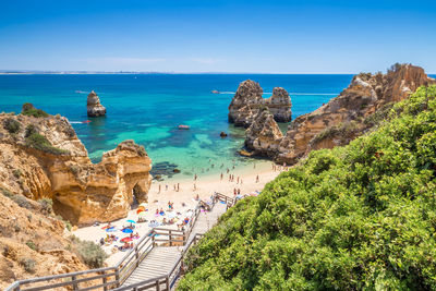 High angle view of beach against clear blue sky during sunny day