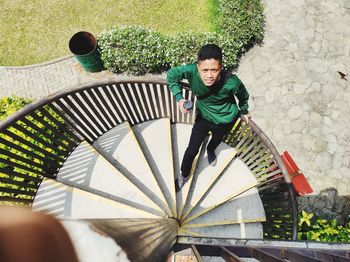 High angle view of boy on staircase