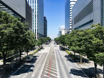 Road amidst buildings in city