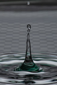 Close-up of drop splashing in water