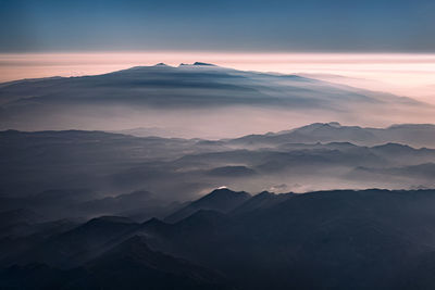 Scenic view of mountains against sky during sunset