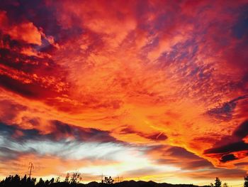 Low angle view of dramatic sky during sunset