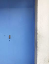 Closed blue door of building