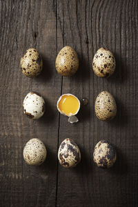 Quail eggs on a wooden table.