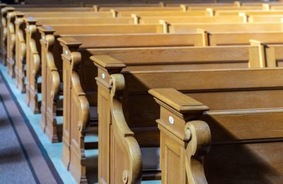 High angle view of empty benches in church 