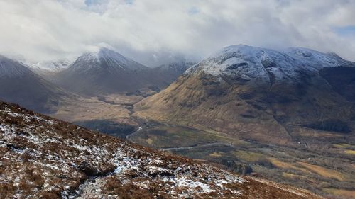 Scenic view of snowcapped mountains against sky