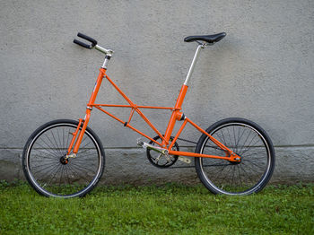 Bicycle leaning against wall