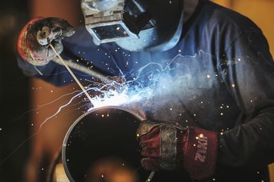 Midsection of man working