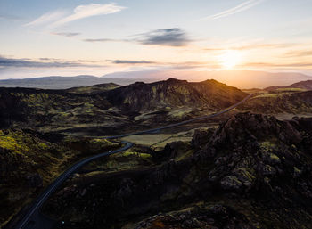Scenic view of mountains against sky during sunset