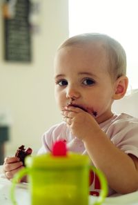 Portrait of cute boy eating food