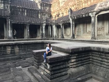 Full length of man on temple outside building