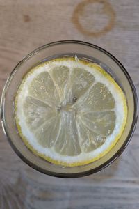 High angle view of lemon in glass on table