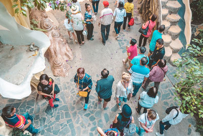 High angle view of people standing on street