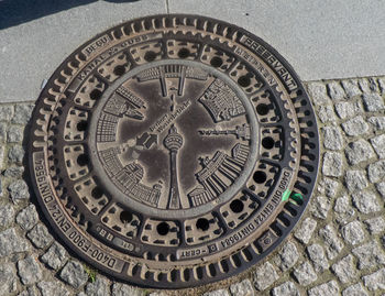 Close-up of clock on brick wall