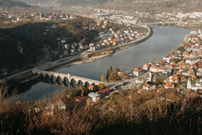High angle view of townscape by lake