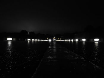 Illuminated tunnel at night