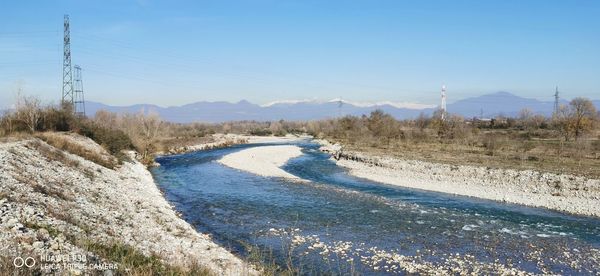 Scenic view of land against clear blue sky