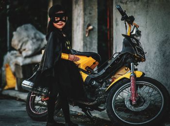 Portrait of man riding motorcycle on street