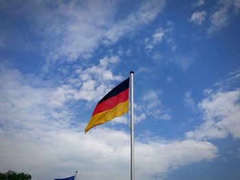 Low angle view of flag against sky