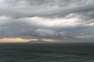 Scenic view of sea against cloudy sky