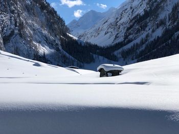 Scenic view of snow covered mountains