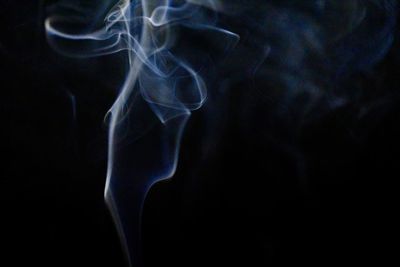 Close-up of smoke against black background