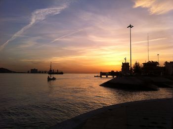 Scenic view of river against sky during sunset