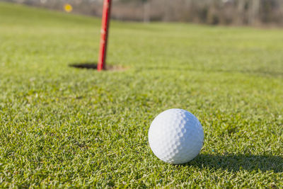 Close-up of ball on golf course