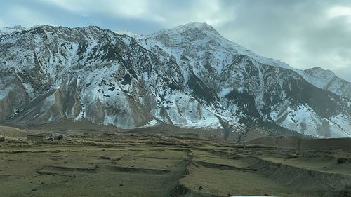 Scenic view of snowcapped mountains against sky