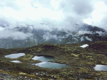 Aerial view of frozen lake against mountain
