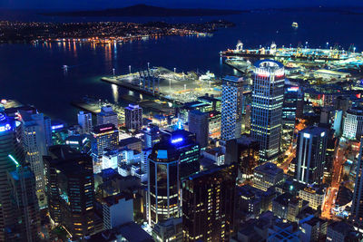 High angle view of city lit up at night