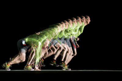 Photograph of a runner in a long exposure with stroboscopic flashes. shot at 20 hz.