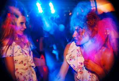 Group of woman dancing in night club