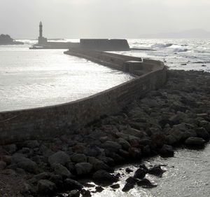 Scenic view of beach against sky during sunset