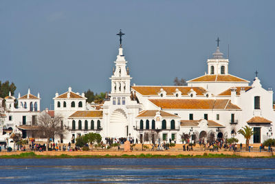 Buildings in city against clear sky