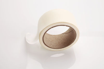 Close-up of adhesive tape over white background
