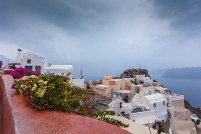 View of oia village on a rare rainy day, santorini, greece