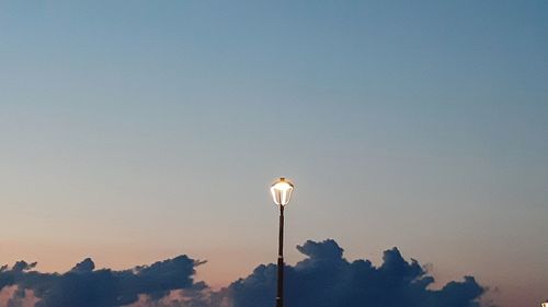 Low angle view of street light against sky