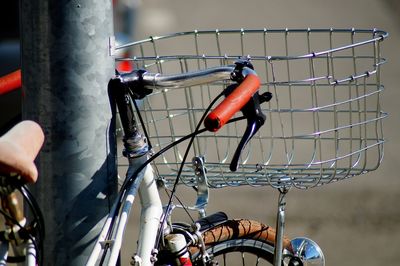 Close-up of man holding bicycle