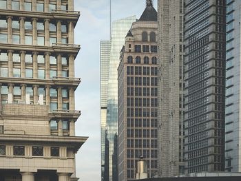 Low angle view of skyscrapers against sky