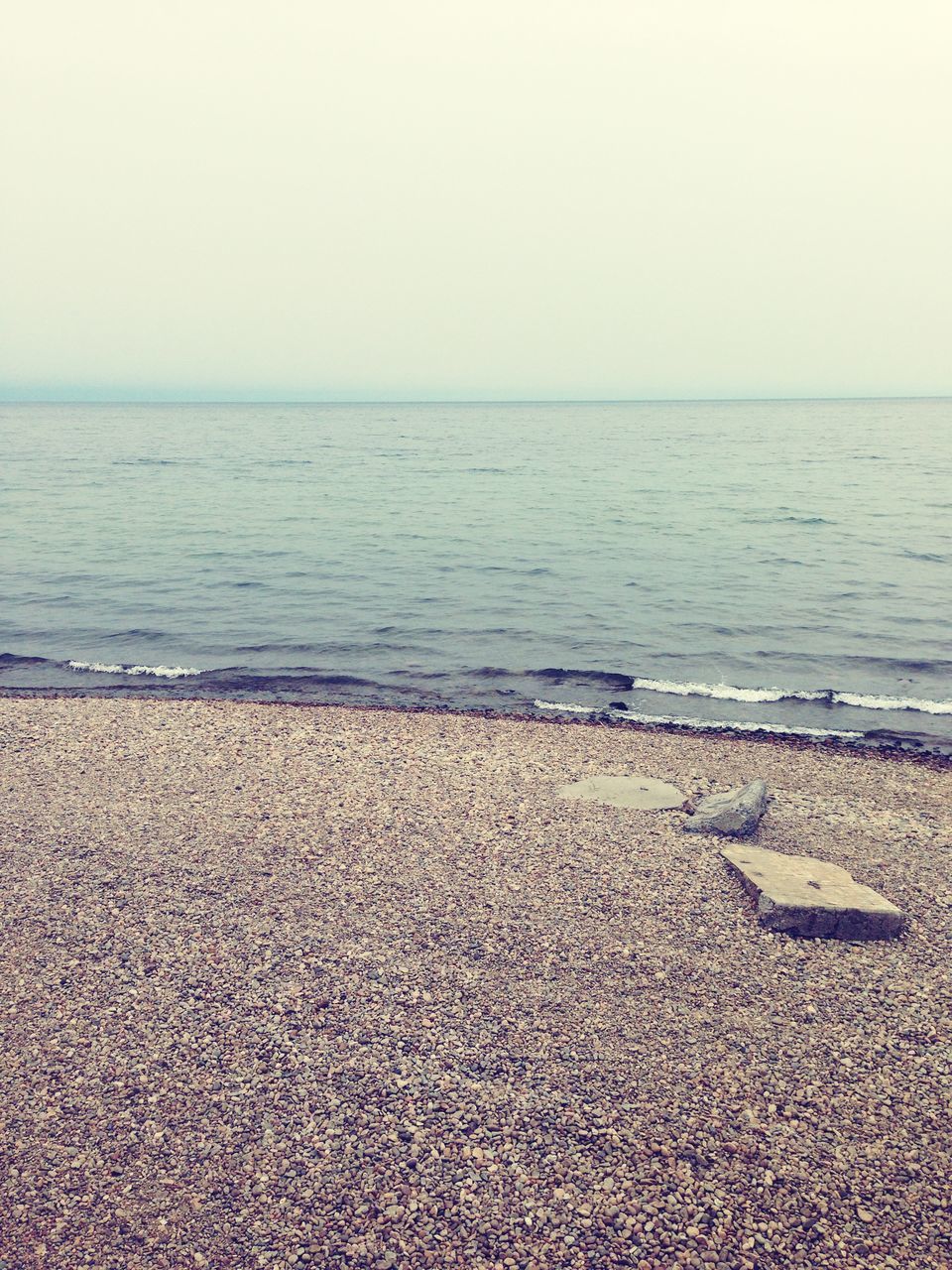 sea, horizon over water, water, beach, shore, clear sky, tranquility, tranquil scene, copy space, scenics, sand, beauty in nature, nature, idyllic, sky, calm, coastline, remote, seascape, day