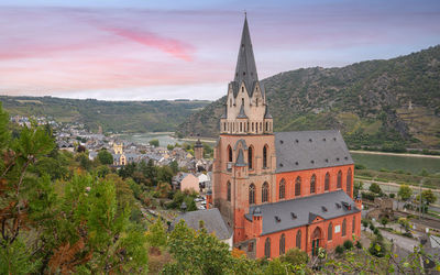 Abbey church of oberwesel against cloudy sky, rhine valley, germany