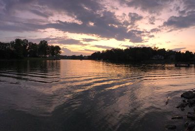 Scenic view of lake against orange sky