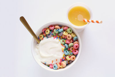 High angle view of breakfast on table against white background