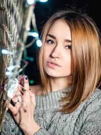 Portrait of young woman in city