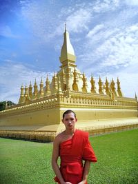 Portrait of mature man standing at temple