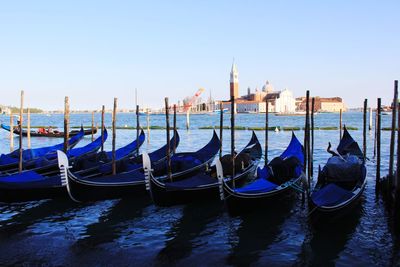 Boats moored at dock