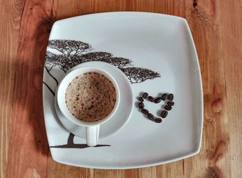 Directly above shot of coffee cup on table