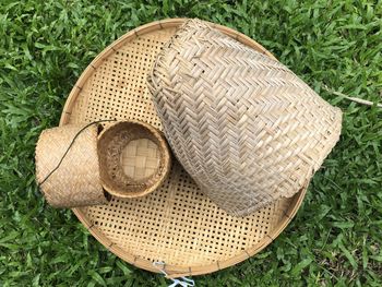 High angle view of wicker basket on field